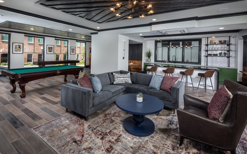 Large well lit lounge with pool table 