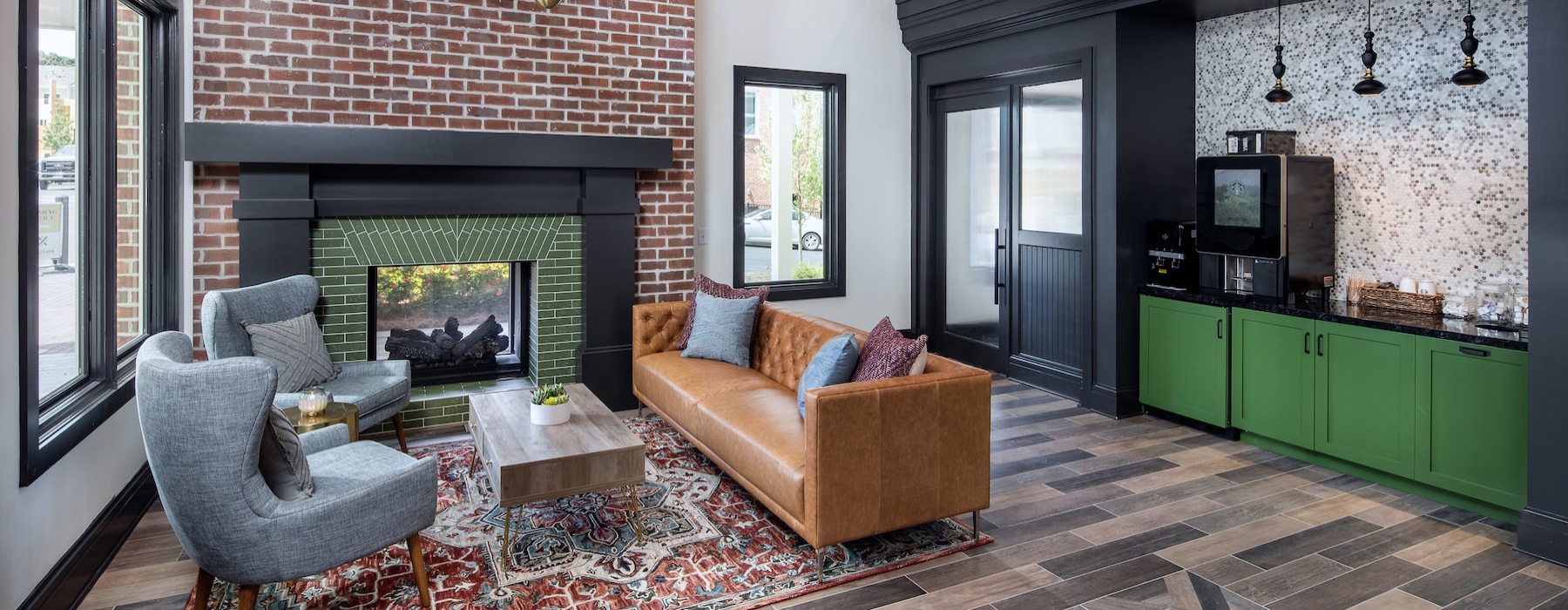 Spacious lounge with wood floors and ample seating